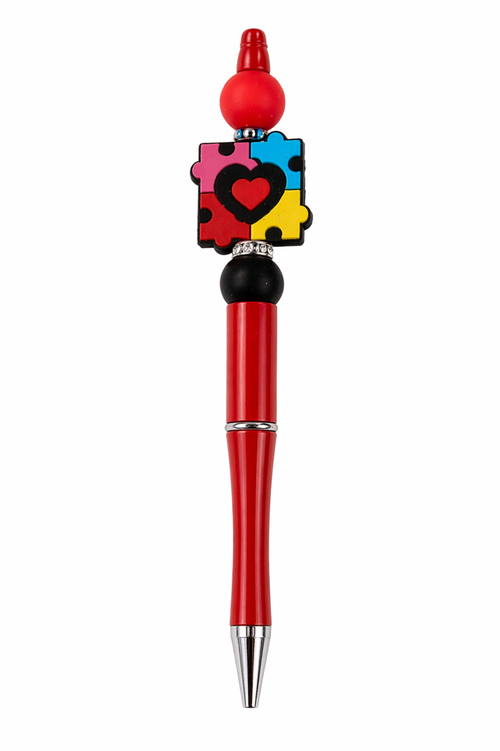 Autism awareness beaded pen with colorful puzzle piece charm.