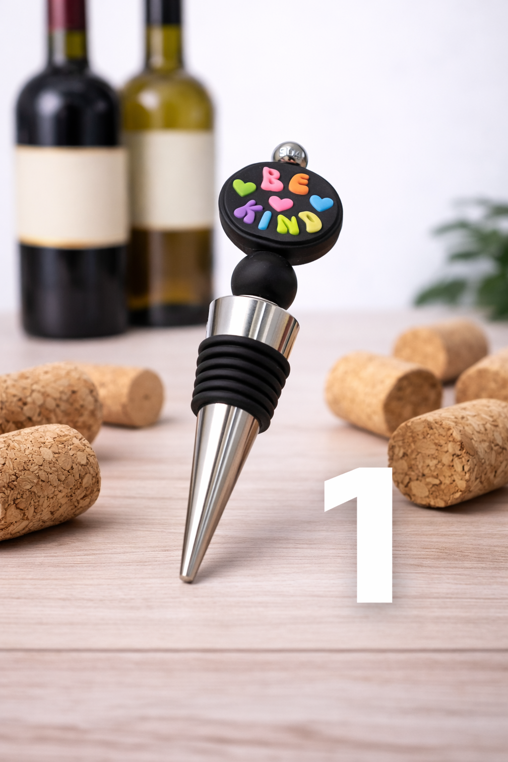 Be Kind wine stopper with colorful heart design.