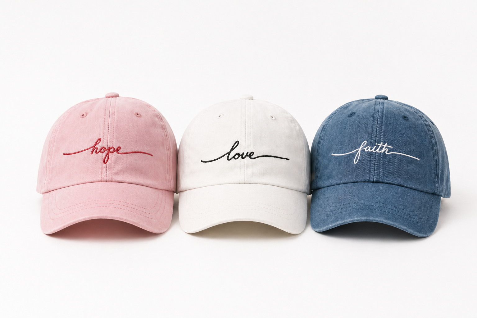 Hope, love, and faith embroidered hats in pastel colors.